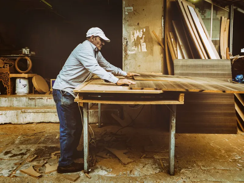Carpenter working wood in a workshop
